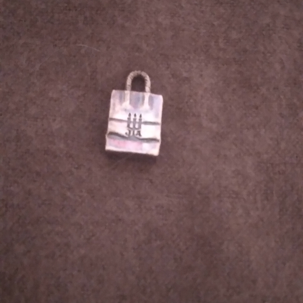 Retired James Avery bag charm